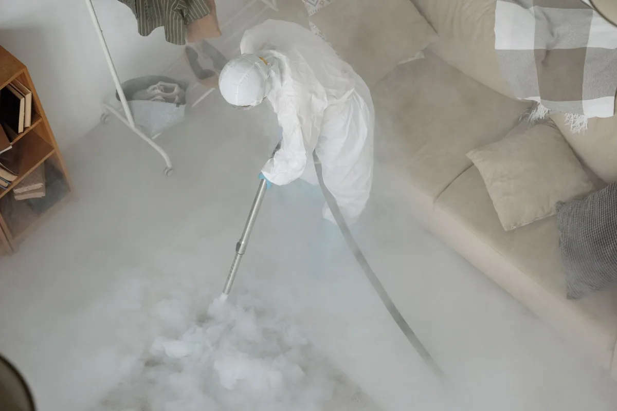 Biohazard cleanup technician in protective equipment, Framingham, MA